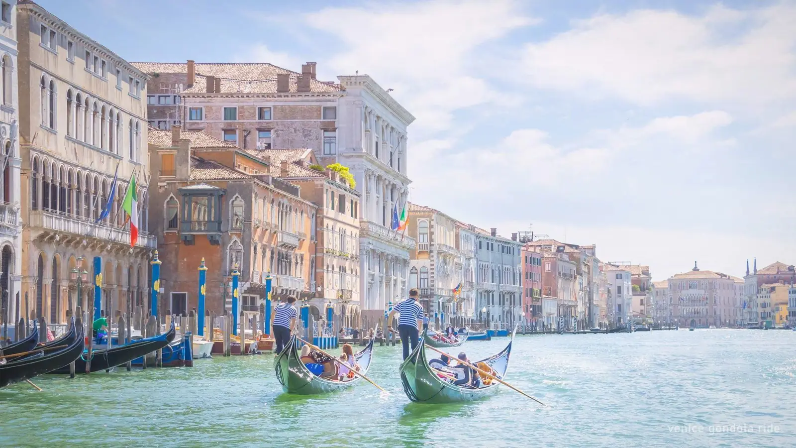 Gondolas on the Grand Canal in Venice, waiting at their moorings
